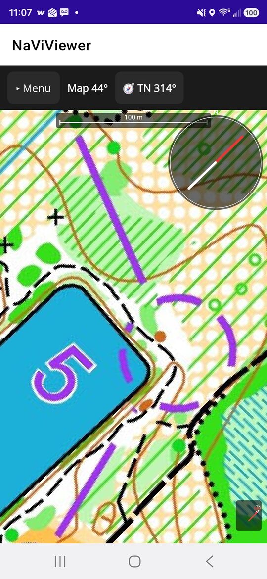 An orienteering map, zoomed in, with the compass and scale bar.